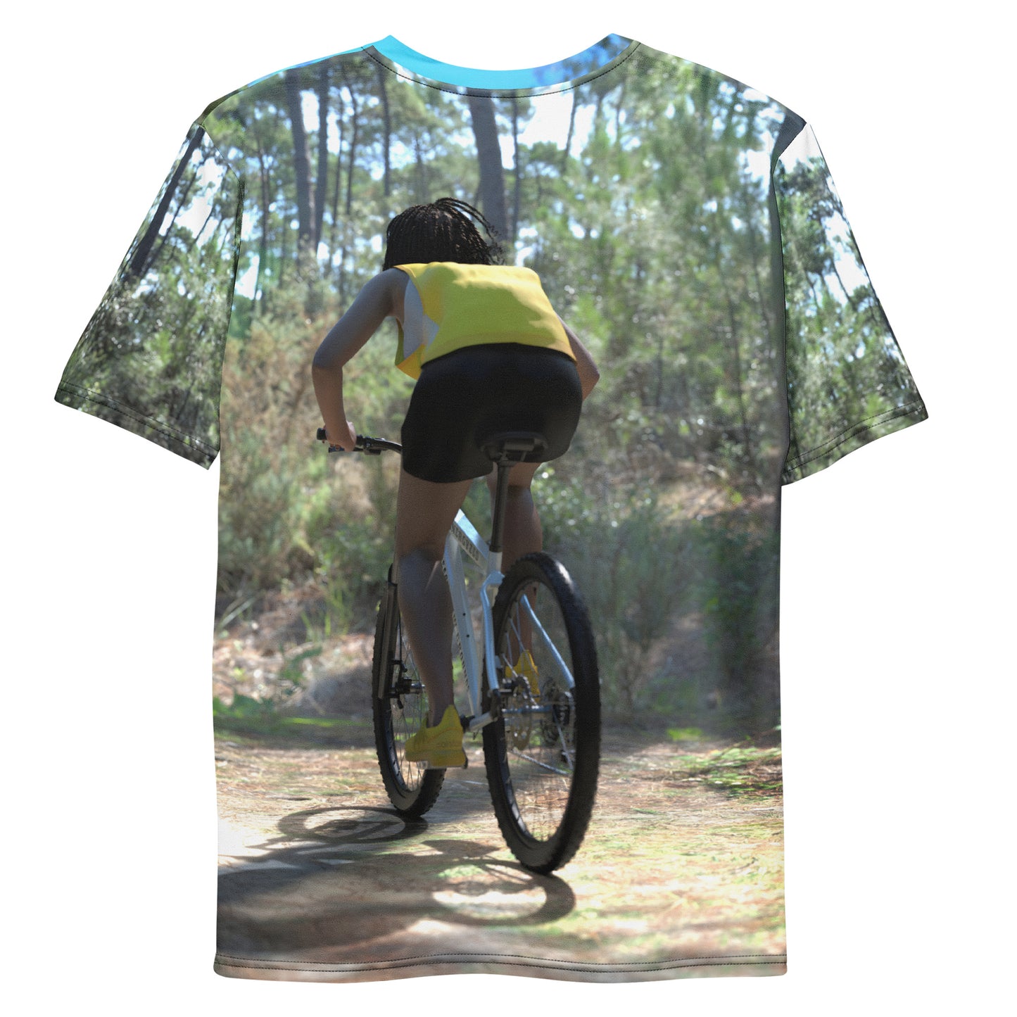 An all over print t-shirt of a black woman riding a bicycle on a trail in the woods.