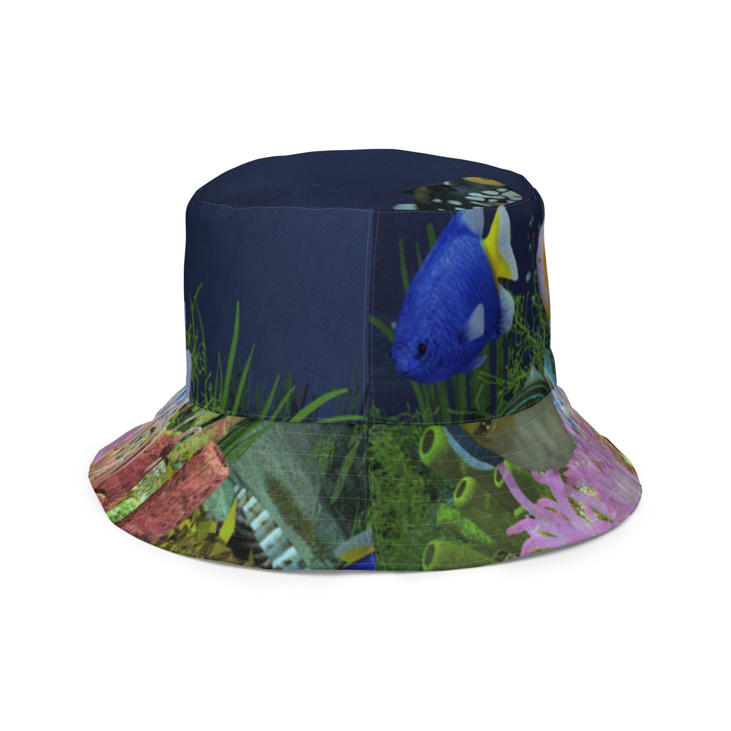 A reversible bucket hat with an image of dark ocean water with fish and a coral reef underwater.