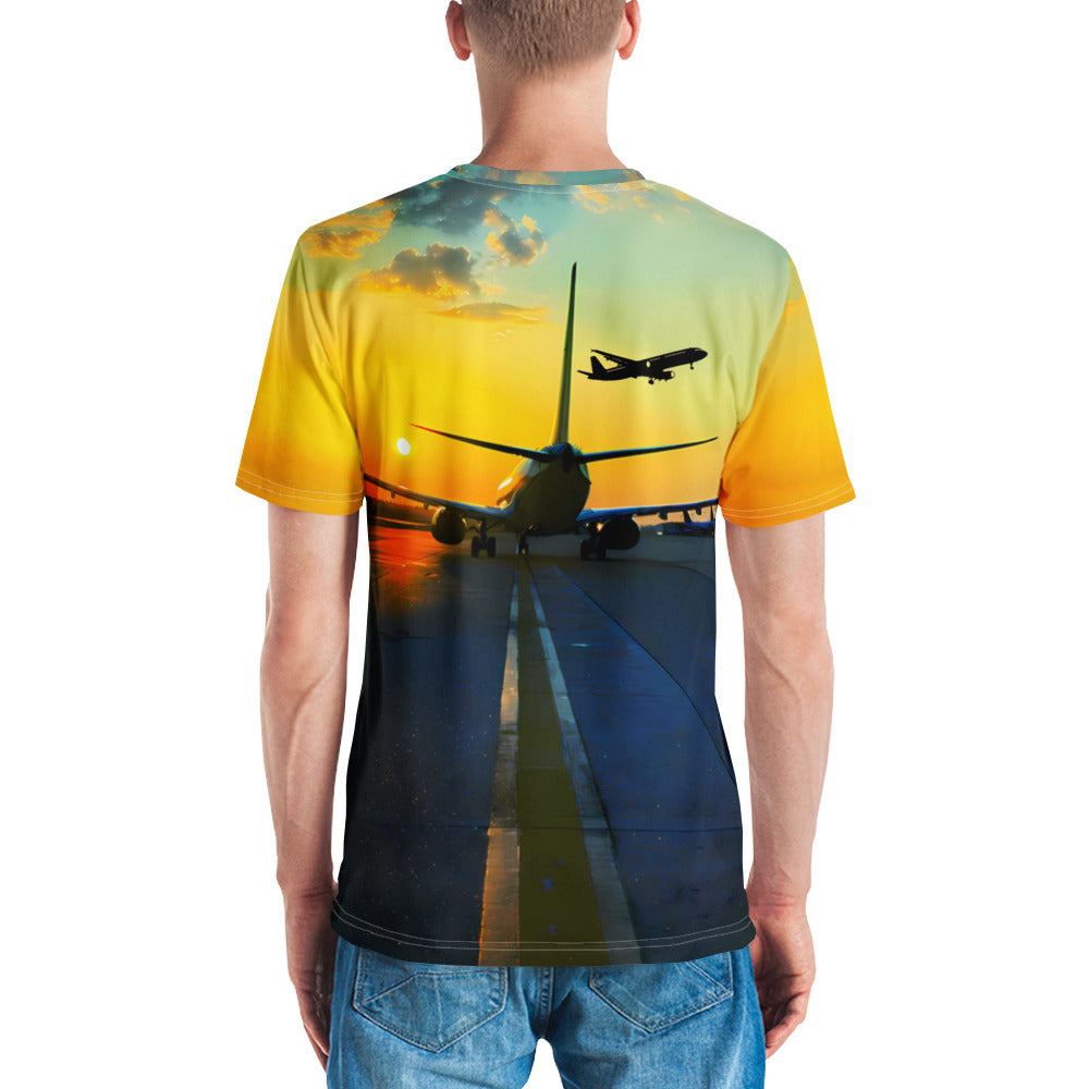 A colorful Let’s Travel crewneck t-shirt with an airplane taxiing away and another airplane in the sky.