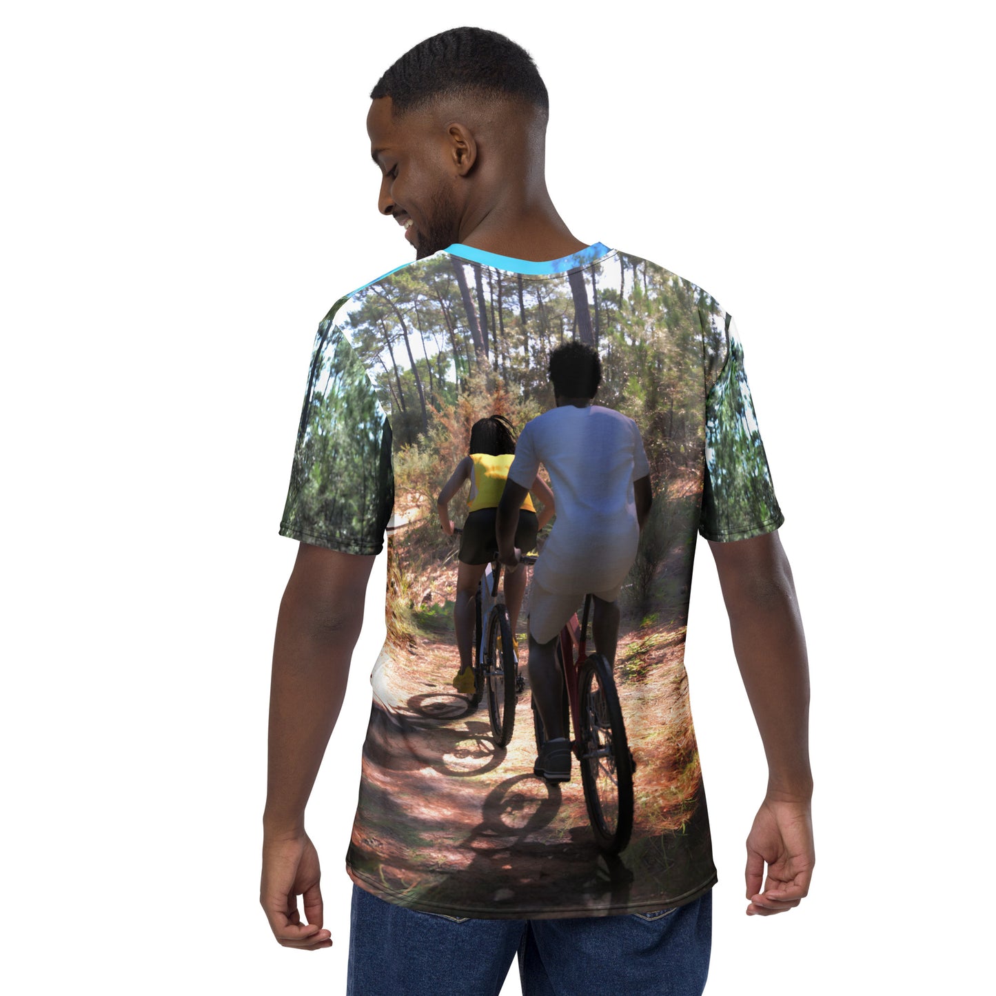An all over print t-shirt of a black man and woman riding bicycles on a trail in the woods.