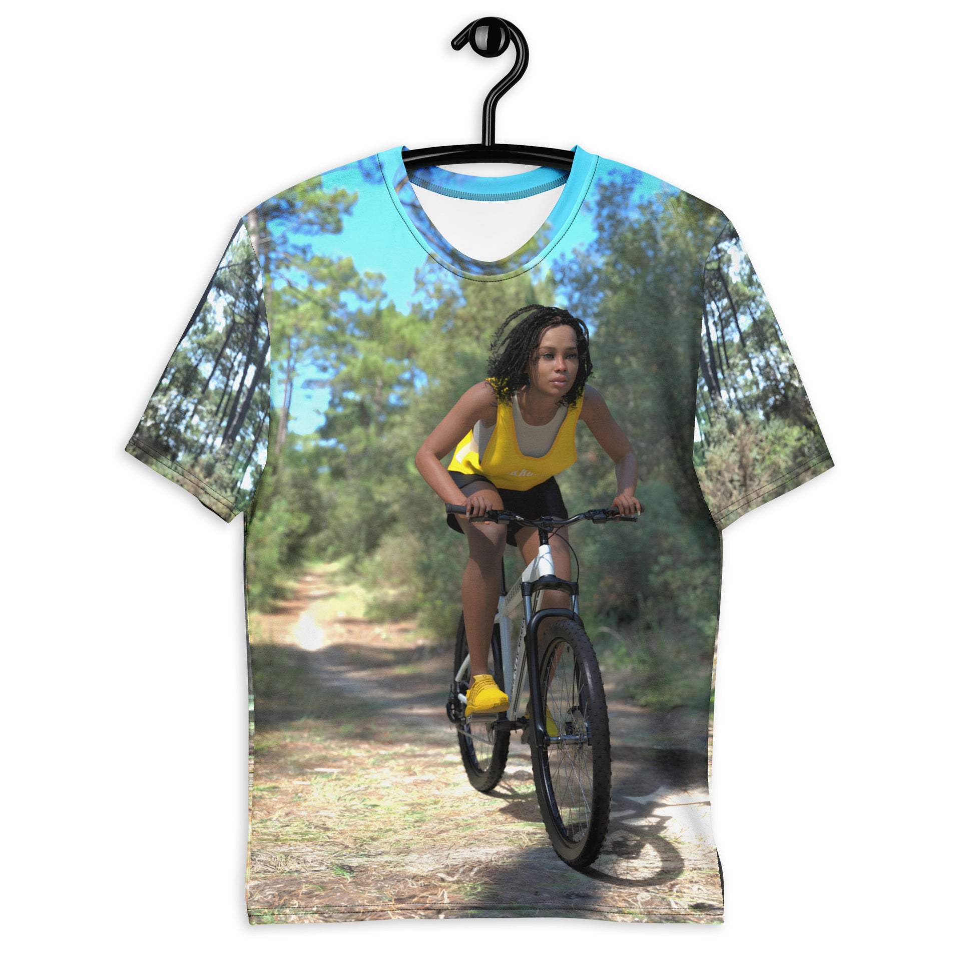 An all over print t-shirt of a black woman riding a bicycle on a trail in the woods.