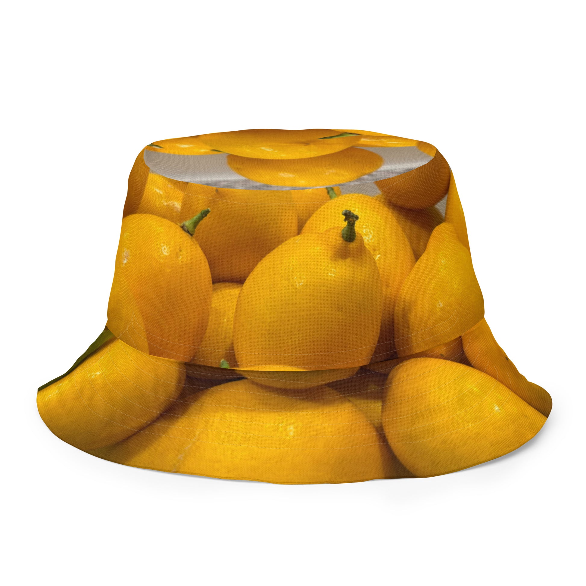 A reversible bucket hat with an image of lemons and a lemon meringue pie.