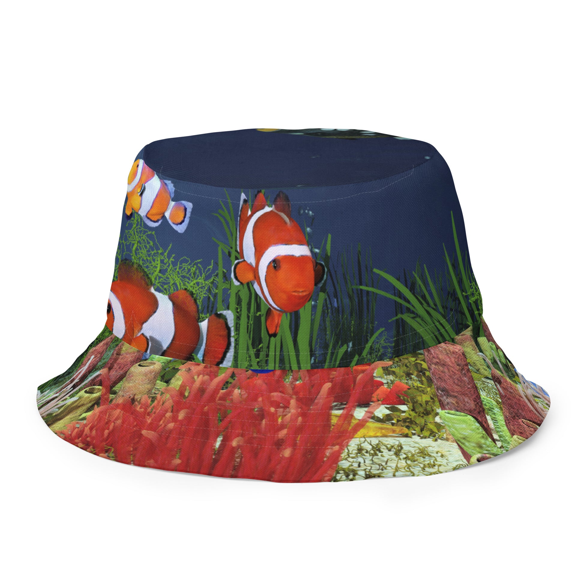 A reversible bucket hat with an image of dark ocean water with fish and a coral reef underwater.