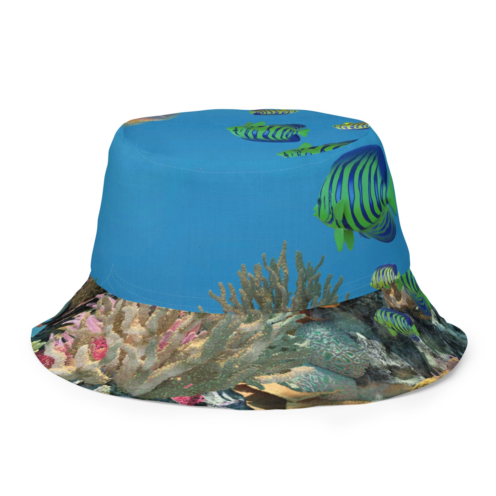 A reversible bucket hat with an image of ocean fish and a coral reef underwater.