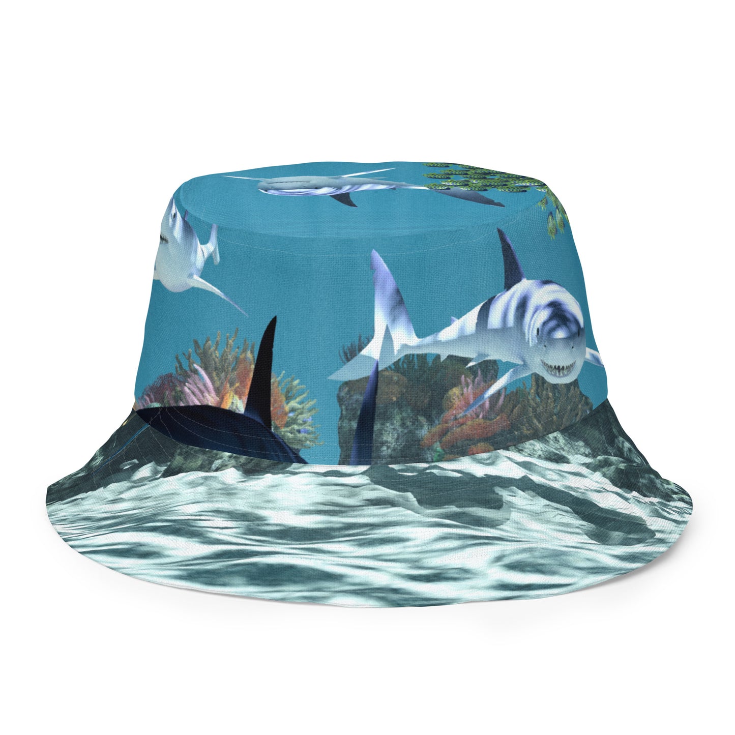A reversible bucket hat with an image of sharks and coral reef underwater.