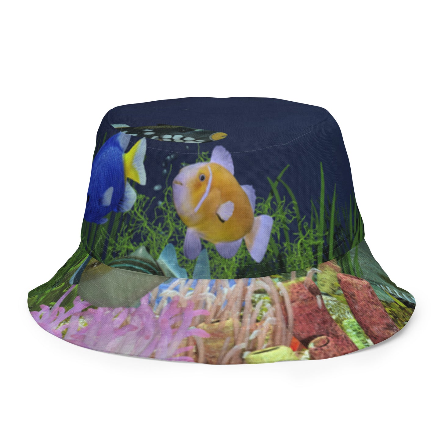 A reversible bucket hat with an image of dark ocean water with fish and a coral reef underwater.