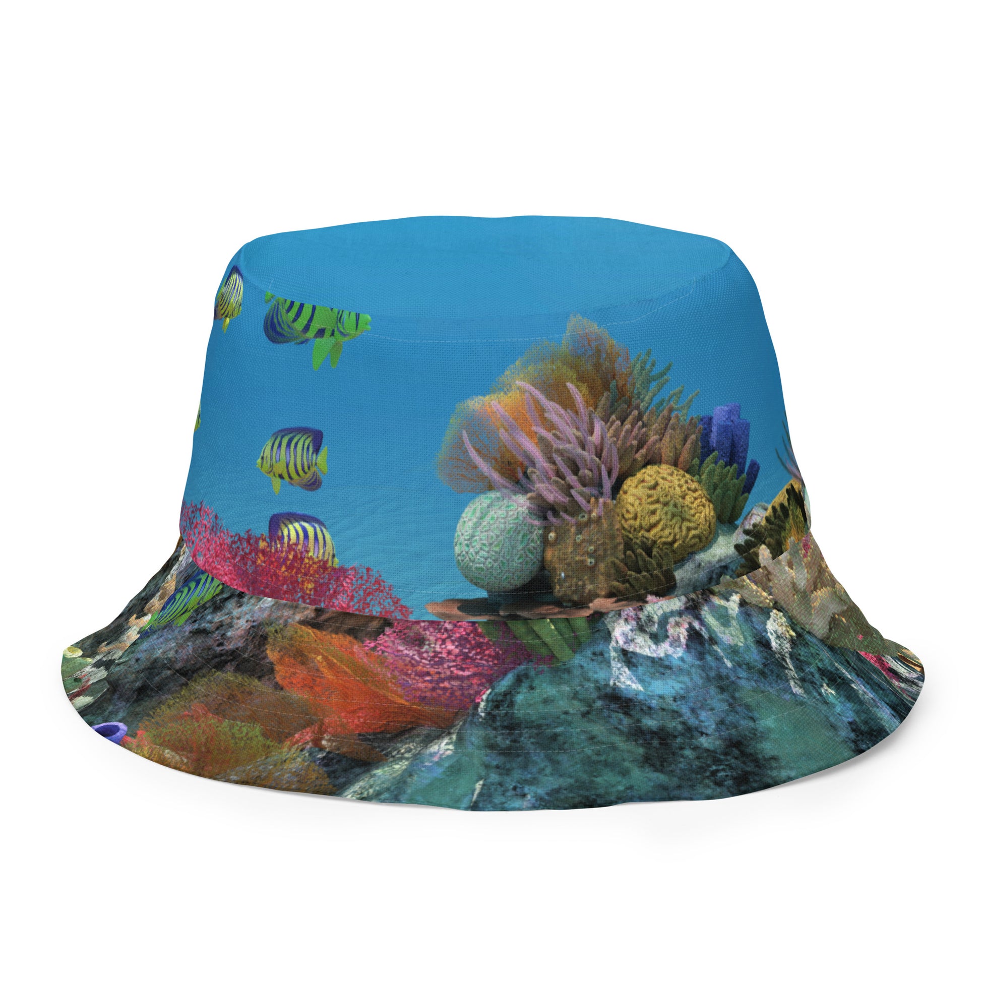 A reversible bucket hat with an image of ocean fish and a coral reef underwater.