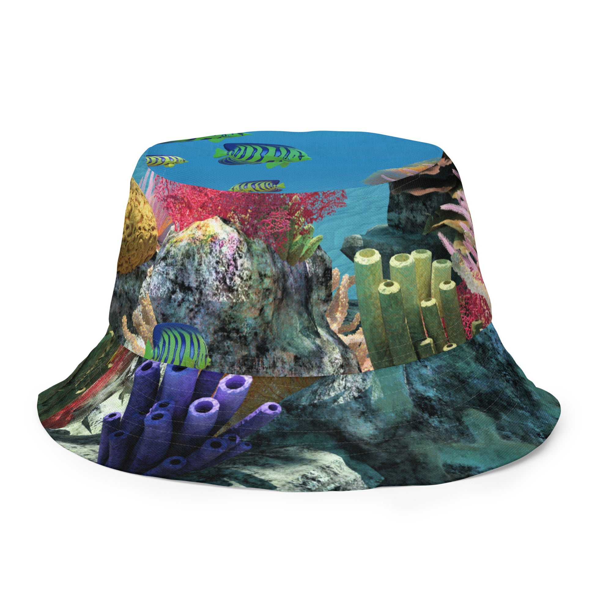 A reversible bucket hat with an image of ocean fish and a coral reef underwater.