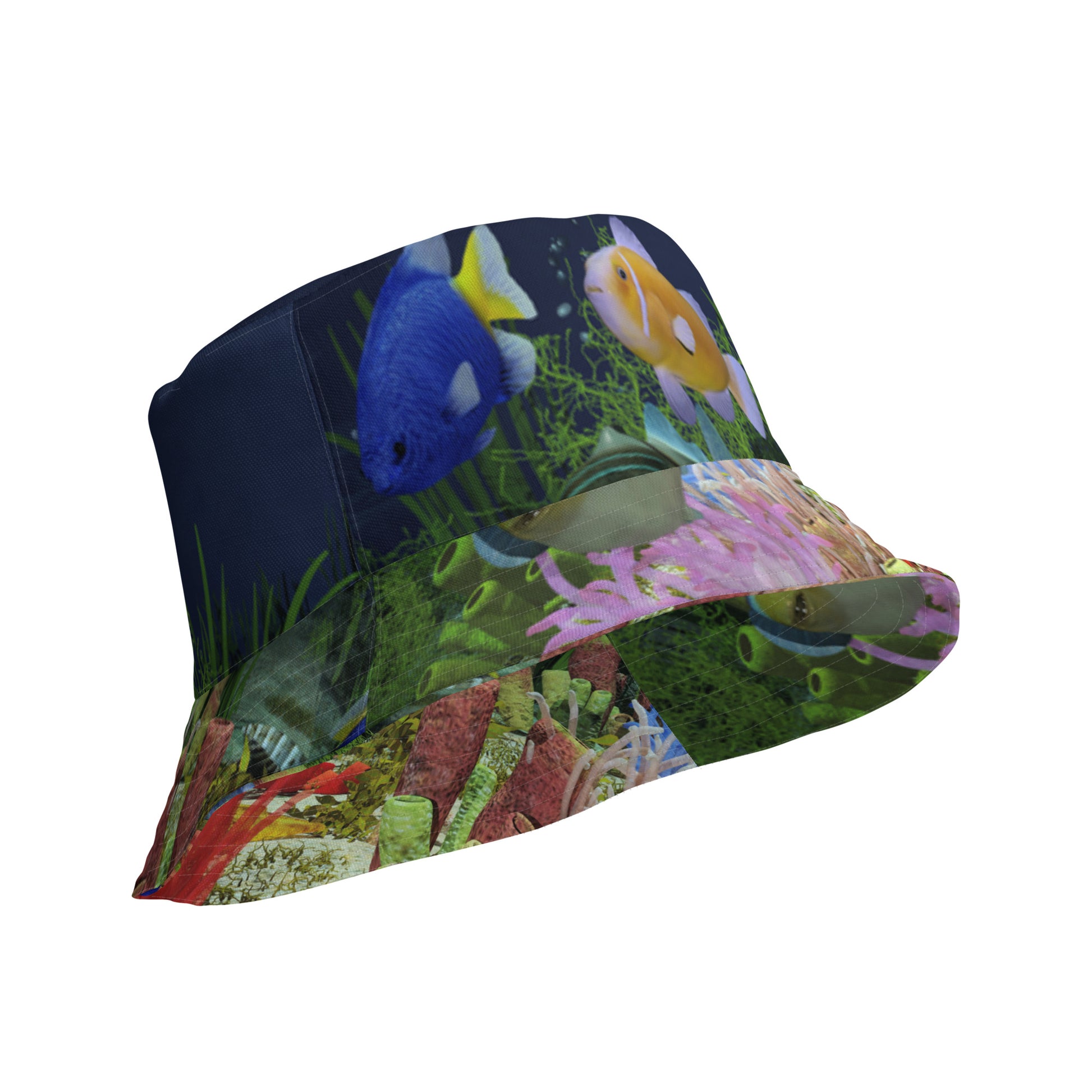 A reversible bucket hat with an image of dark ocean water with fish and a coral reef underwater.