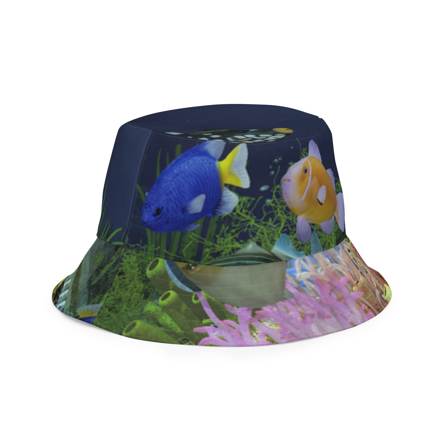 A reversible bucket hat with an image of dark ocean water with fish and a coral reef underwater.