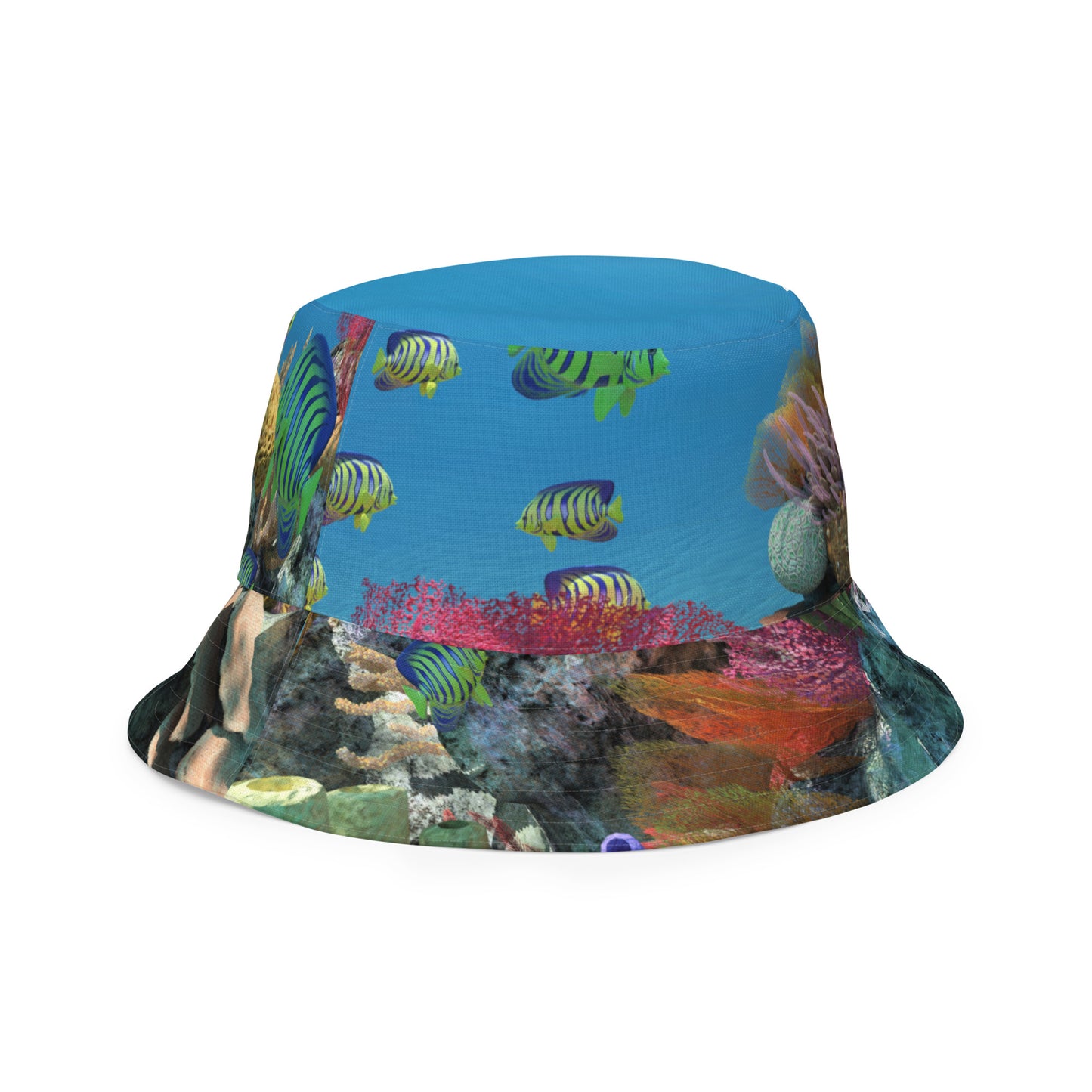 A reversible bucket hat with an image of ocean fish and a coral reef underwater.
