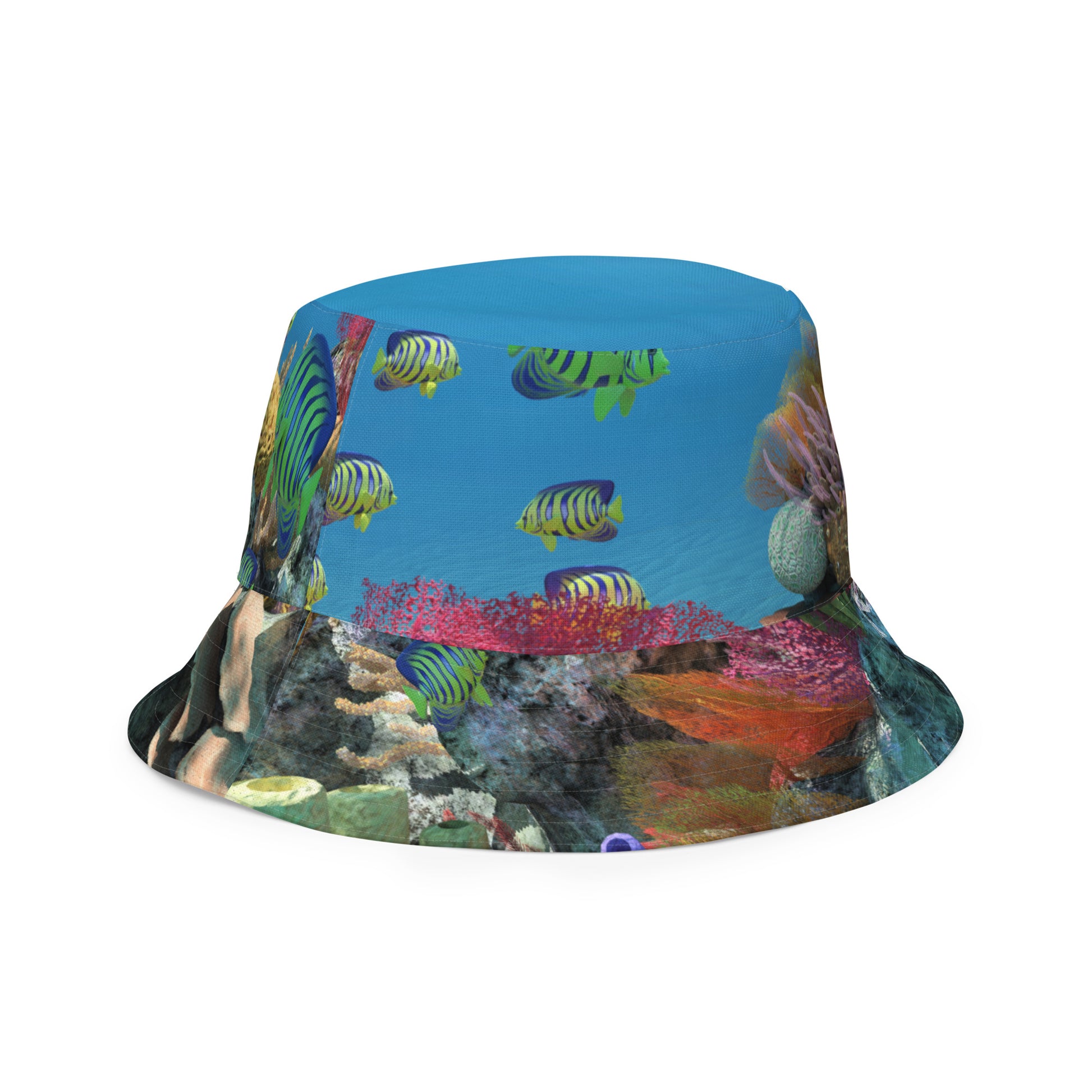 A reversible bucket hat with an image of ocean fish and a coral reef underwater.