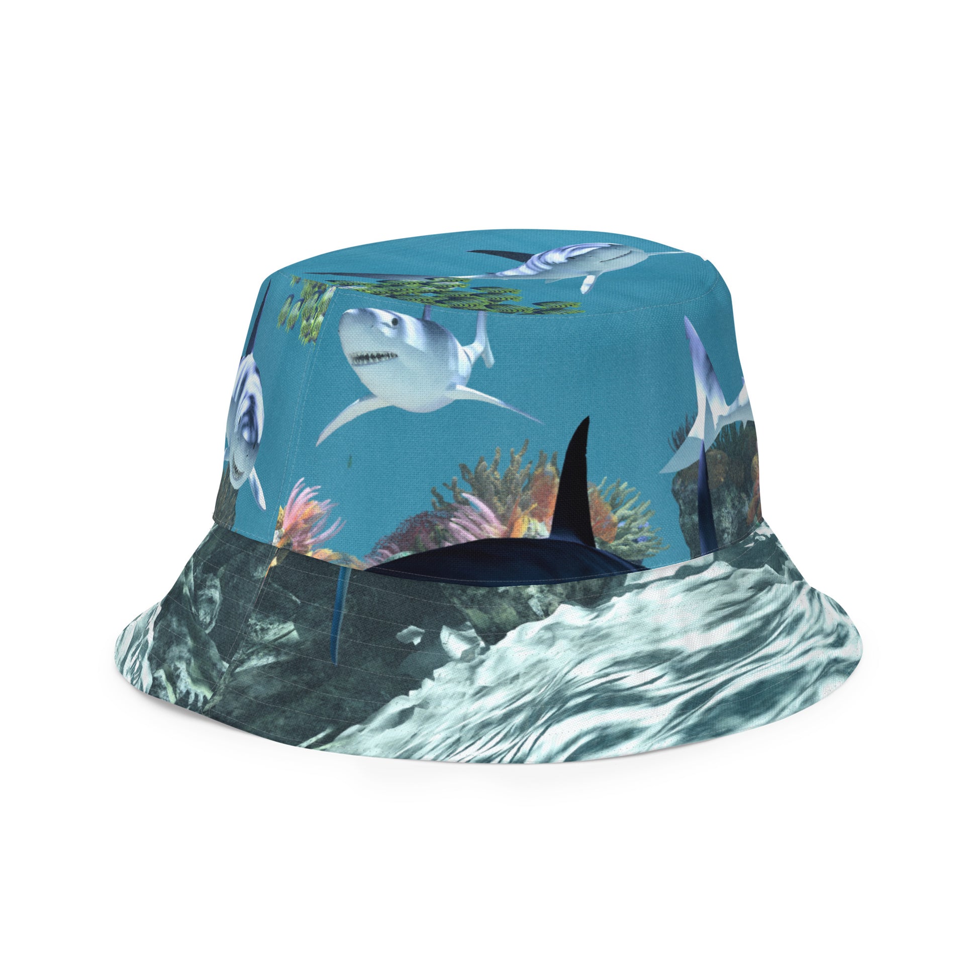 A reversible bucket hat with an image of sharks and coral reef underwater.