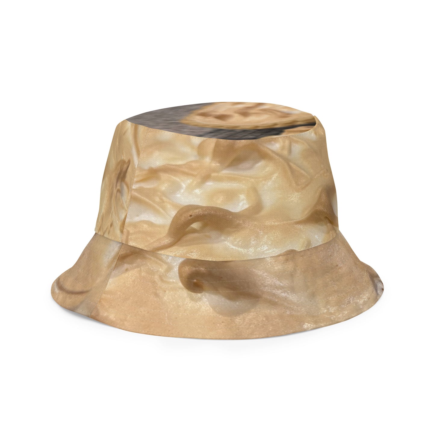A reversible bucket hat with an image of lemons and a lemon meringue pie.