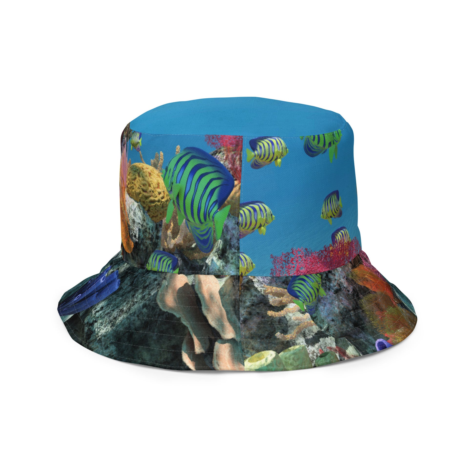 A reversible bucket hat with an image of ocean fish and a coral reef underwater.