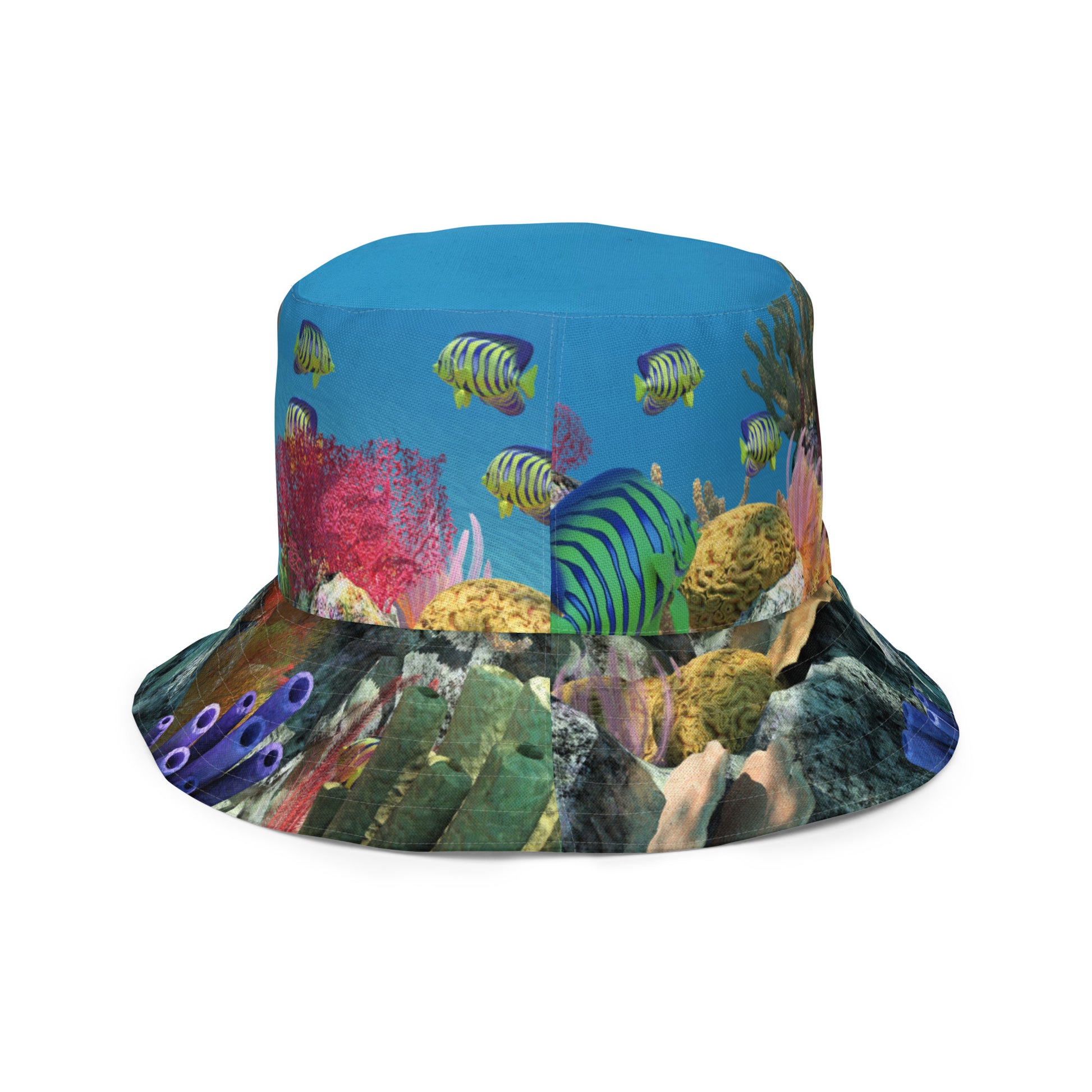 A reversible bucket hat with an image of sharks and coral reef underwater.