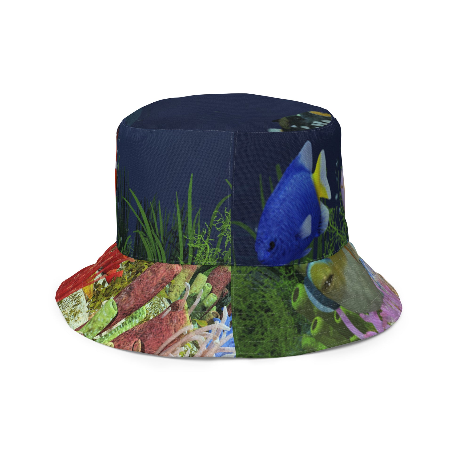 A reversible bucket hat with an image of dark ocean water with fish and a coral reef underwater.