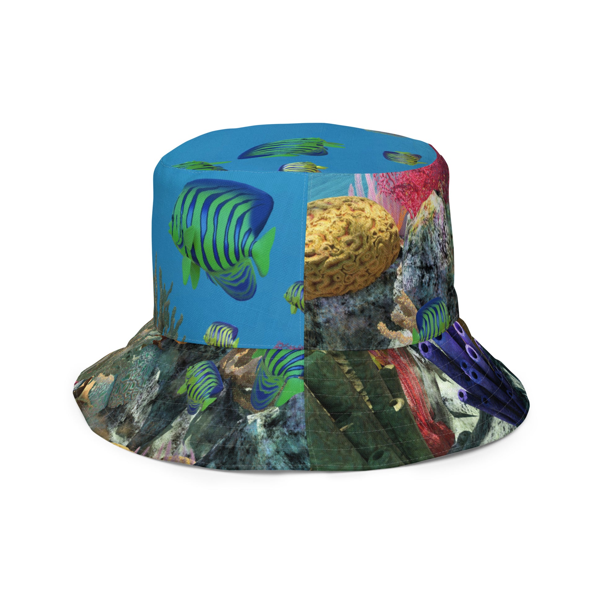 A reversible bucket hat with an image of ocean fish and a coral reef underwater.