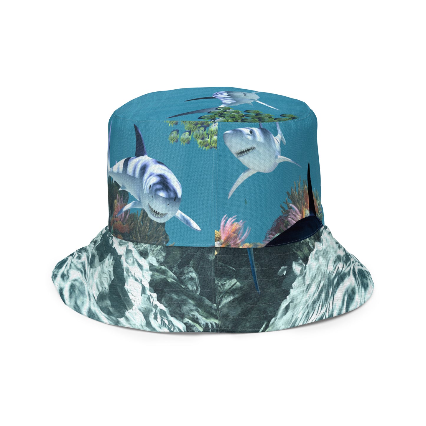 A reversible bucket hat with an image of sharks and coral reef underwater.